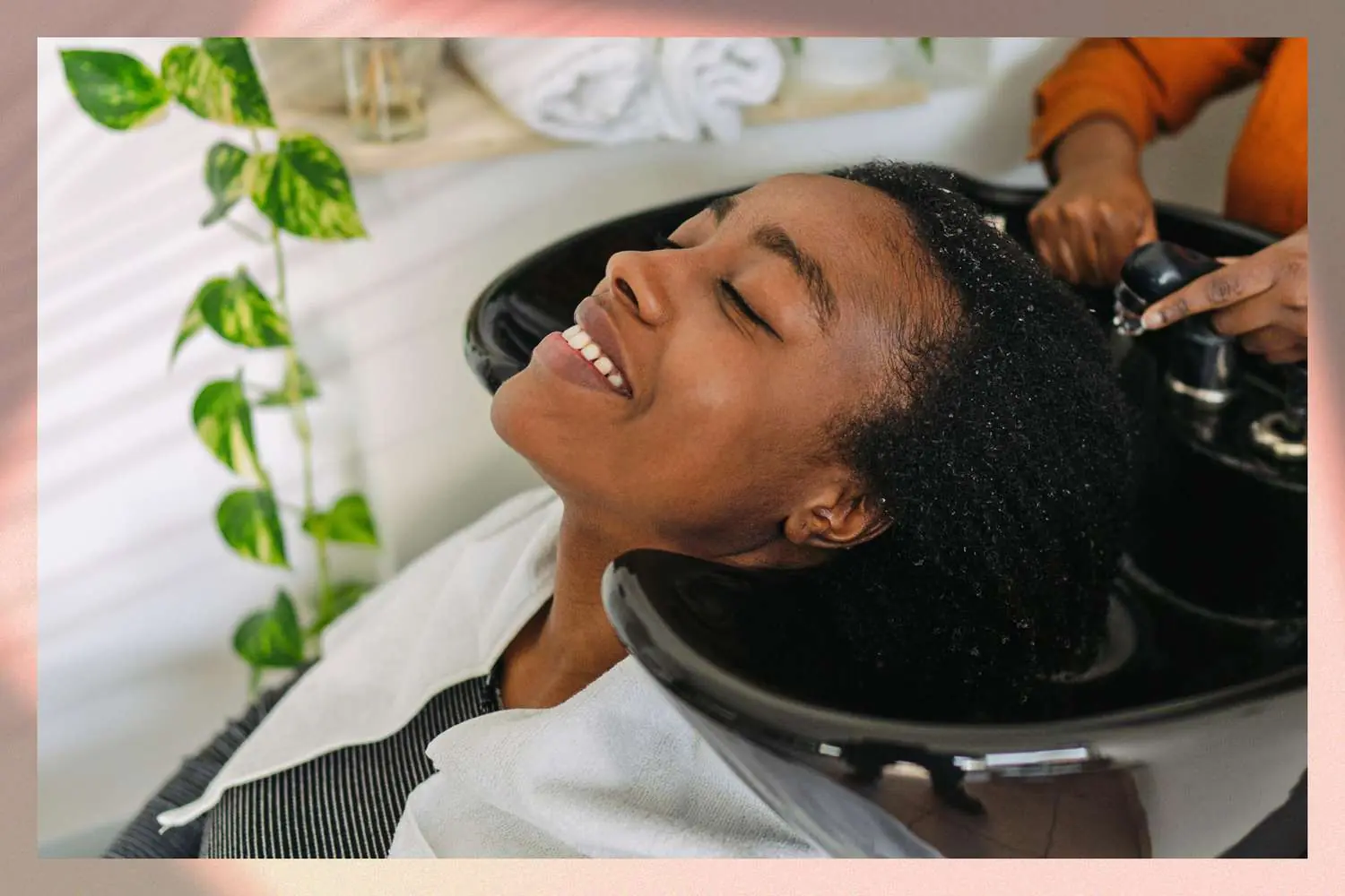 Smiling Hakeem Hair client